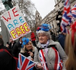 Brexiteers celebrate in London, Jan. 31, 2020.