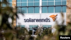 The SolarWinds logo is seen outside its headquarters in Austin, Texas, Dec. 18, 2020.