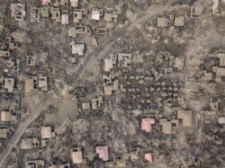 An aerial view shows the landscape of Buso Buso, Philippines, covered in ash following the eruption Taal volcano, Jan. 19, 2020.