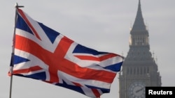 A Union flag flies in front of the Big Ben clock tower in London, Britain, Jan. 23, 2017. 