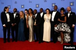 FILE - The cast and crew of "Moonlight" pose backstage with their award for Best Motion Picture - Drama at the 74th Annual Golden Globe Awards in Beverly Hills, Calif., Jan. 8, 2017.