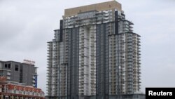 FILE - A general view of a building at Diamond Island also known as 'Koh Pich' is seen from Tonle Chaktomuk river in Phnom Penh, Cambodia, May 22, 2018.