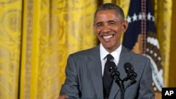 President Barack Obama smiles during an event with Young Southeast Asian Leaders Initiative fellows in the East Room of the White House, June 1, 2015.