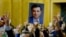 FILE - A supporter holds a portrait of Selahattin Demirtas, detained leader of Turkey's pro-Kurdish opposition Peoples' Democratic Party, at a meeting at the Turkish parliament in Ankara, Nov. 8, 2016.