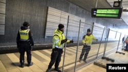 A temporary fence is erected between domestic and international tracks is seen at Hyllie train station in southern Malmo, Sweden, Jan. 3, 2016.