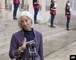FILE - International Monetary Fund managing director Christine Lagarde addresses reporters as she leaves the Elysee Palace, Nov.8, 2013.