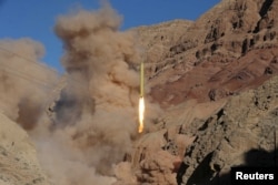 A ballistic missile is launched and tested in an undisclosed location, Iran, March 9, 2016.