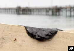 This Santa Barbara County Fire Department photo shows a sample of oil scraped off the side of a kayak at the Goleta Beach parking lot, July 29, 2015.