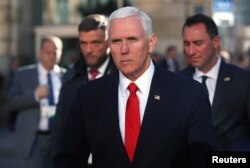 FILE - U.S. Vice President Mike Pence walks outside the Hotel Bayerischer Hof during the Munich Security Conference in Munich, Germany, Feb. 16, 2019.