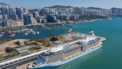 Aerial photo showing the 'Spectrum of the Seas' docked at a terminal in Hong Kong on Jan. 5, 2022, after it was ordered to return to the city for coronavirus testing after 9 people were found to be close contacts with a recent Omicron variant outbreak.