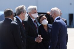 President Joe Biden is welcomed by Sen. Bill Cassidy, R-La., Sen. John Kennedy, R-La., New Orleans Mayor LaToya Cantrell and Louisiana Rep.-elect Troy Carter at Louis Armstrong New Orleans International Airport in Kenner, La., May 6, 2021.