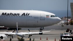 FILE - A Mahan Air airplane is seen at Simon Bolivar International Airport outside Caracas, Venezuela, April 8, 2019.