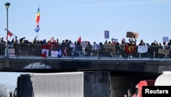 Truckers protest against COVID-19 vaccine mandate