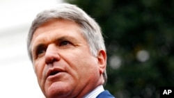 FILE - Rep. Mike McCaul, R-Texas, speaks with members of the media outside of the White House, Oct. 16, 2019.