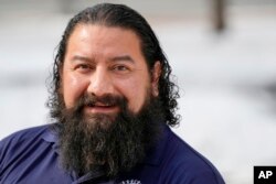 United Auto Workers union member Leo Carrillo, poses for a photograph on Jan. 23, 2024, in Washington. Carrillo, a member from Kansas City, said Biden’s appearance on the picket line helped him to decide to vote for Biden in November.