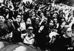 Hundreds of Iranian woman demonstrate in front of presidential office against the clergy order for all Iranian female employees of government offices to put on veils at work, in Tehran, July 5, 1980.