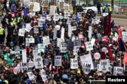People participate in a march commemorating the 50th anniversary of the death of civil rights leader Martin Luther King Jr. in Memphis, Tenn., April 4, 2018.