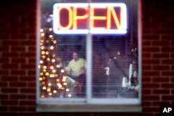 Steven Whitt opens the Frosty Freeze restaurant that he runs with his wife in Sandy Hook, Ky., Dec. 13, 2017.