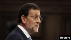 Spain's Prime Minister Mariano Rajoy gestures during a parliamentary session in Madrid, July 11, 2012.