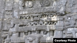 Stone monuments like this stucco frieze in Caracol, Belize, document Maya battles, births and burials. (Photo image of Douglas Kennett, Penn State)
