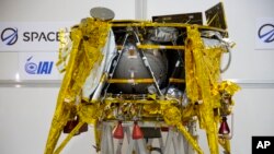 The SpaceIL lunar module, an unmanned spacecraft, is on display in a special "clean room" where the space craft is being developed, during a press tour of their facility near Tel Aviv, Israel, Monday, Dec. 17, 2018. (AP Photo/Ariel Schalit)