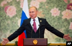 Russian President Vladimir Putin speaks during a news conference after the Shanghai Cooperation Organization (SCO) Summit in Qingdao in eastern China's Shandong Province, June 10, 2018.