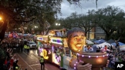 The Officer's Float rolls down Napoleon Avenue as the 1,600 men of Bacchus present their 32-float Mardi Gras parade entitled "Starring Louisiana" on the Uptown route in New Orleans on Sunday, March 3, 2019. (Michael DeMocker/The Times-Picayune via AP)
