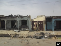 FILE - Victims of a suicide bomb explosion at a World Cup viewing center receive treatment at Sani Abacha specialist hospital in Damaturu, Nigeria, June 18, 2014.