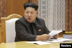Kim Jong Un speaks at an emergency meeting of the Workers' Party of Korea (WPK) Central Military Commission in Pyongyang, in this undated photo from North Korea's Korean Central News Agency (KCNA), Aug. 21, 2015.