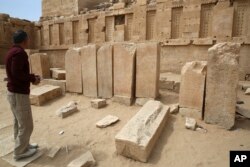 A Yemeni official explores the Awwam Temple, also known as the Mahram Bilqis, in Marib, Yemen, Feb. 3, 2018.
