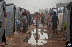 FILE – A refugee camp in Suruc, on the Turkey-Syria border, Oct. 11, 2014.