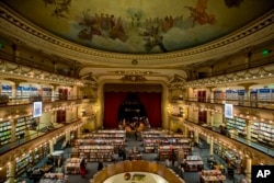 Customers walk around the El Ateneo Grand Splendid bookstore located in a former theater in Buenos Aires, Argentina.