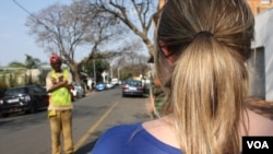 This young woman, who asked to remain anonymous, alleges the Metro Police assaulted her and accused her of driving drunk, at this intersection in Johannesburg, Sept. 11, 2015. (VOA / D. Taylor)