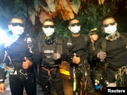 FILE - Four Thai navy SEALs are seen after leaving the cave safe during the rescue mission, Chiang Rai Province, Thailand, July 10, 2018 in this photo obtained from social media.