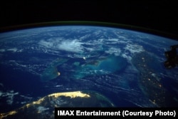 The world's largest cities sparkle with artificial lights at night.