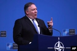 U.S. Secretary of State Mike Pompeo speaks during a media conference after a meeting of NATO foreign ministers at NATO headquarters in Brussels, Tuesday, Dec. 4, 2018.