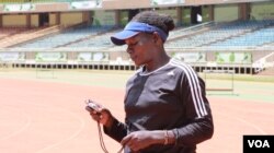 Coach Caroline Kola hopes her 32 young athletes will excel in their various events. (L. Ruvaga/VOA)