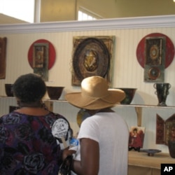 Visitors check out Lori Gordon's work at Gallery 220 in Bay St. Louis, Mississippi.