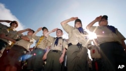 In this Saturday morning, May 21, 2011 file photo, Boy Scouts salute during a "camporee" in Sea Girt, N.J. The Wednesday, Oct. 11, 2017 (AP Photo/Mel Evans)