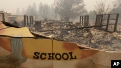 The burned remains of the Paradise Elementary school is seen Friday, Nov. 9, 2018, in Paradise, Calif. (AP Photo/Rich Pedroncelli)