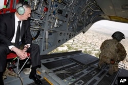 FILE - U.S. Defense Secretary Jim Mattis looks out over Kabul as he arrives via helicopter at Resolute Support headquarters in Kabul, Afghanistan, April 24, 2017.