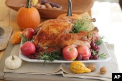 This Oct. 12, 2015, photo shows a roasted Thanksgiving turkey in Concord, New Hampshire, United States. (AP Photo/Matthew Mead)