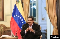 Venezuela's President Nicolas Maduro speaks during a meeting with members of the Venezuelan diplomatic corp after their arrival from the United States, at the Miraflores Palace in Caracas, Jan. 28, 2019.