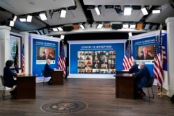 From left, CDC Director Dr. Rochelle Walensky, President Joe Biden, White House COVID coordinator Jeff Zients and Dr. Anthony Fauci meet remotely with governors at the White House.