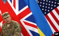 Commander of the International Security Assistance Force (ISAF), Gen. John Campbell, speaks during a ceremony at the ISAF headquarters in Kabul, Afghanistan, Dec. 28, 2014.