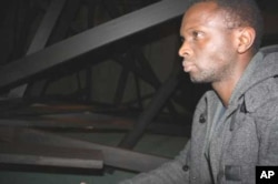 Nitegeka inside his latest installation, ‘…and walk in my shoes…’