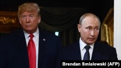 FINLAND -- US President Donald Trump and Russian President Vladimir Putin arrive for a meeting in Helsinki, on July 16, 2018.