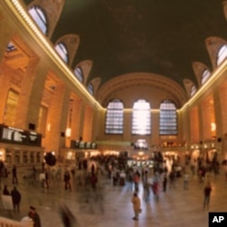 Passengers wait for trains in the United States, where immigrants can help bolster the working age population.