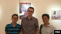 Author Ryun Patterson and photographer Rick Valenezuela posed with a Cambodian student who helped with the translation of the ‘Vanishing Act’.