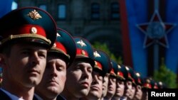 Russian servicemen march during a Victory Day Parade in Moscow's Red Square on May 9, 2014.